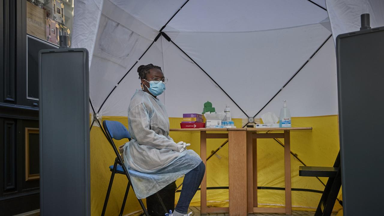 A Covid tester waits for patients at a pharmacy in Paris, France as new cases surge past 200,000 per day. Picture: Kiran Ridley/Getty Images