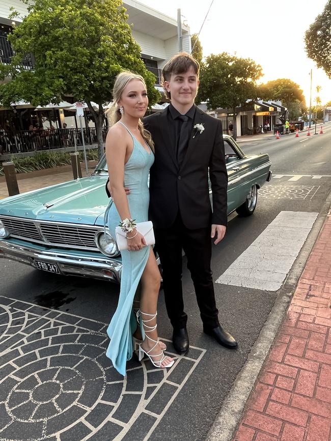 Polly Robertson and Tyler Houston arrive at the formal in style.