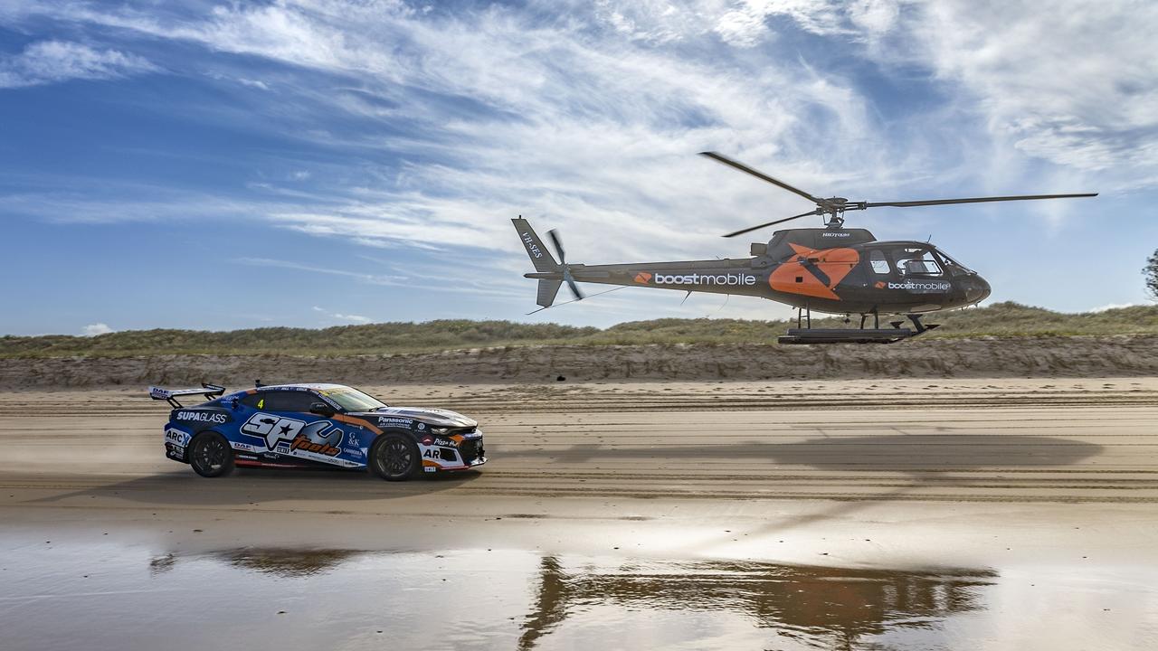 Supercars driver Cameron Hill, the Boost drift car, Buggy, Chopper, and Stunt plain as they raced along Main Beach today ahead of this weekend’s Boost Mobile GC 500, Event 11 of the Repco Supercars Championship, Surfers Paradise, Gold Coast, Queensland, Australia.