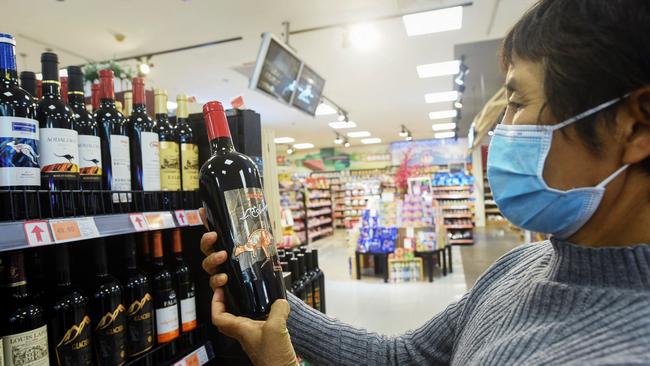 Buying wine in a supermarket in Hangzhou. Picture: AFP