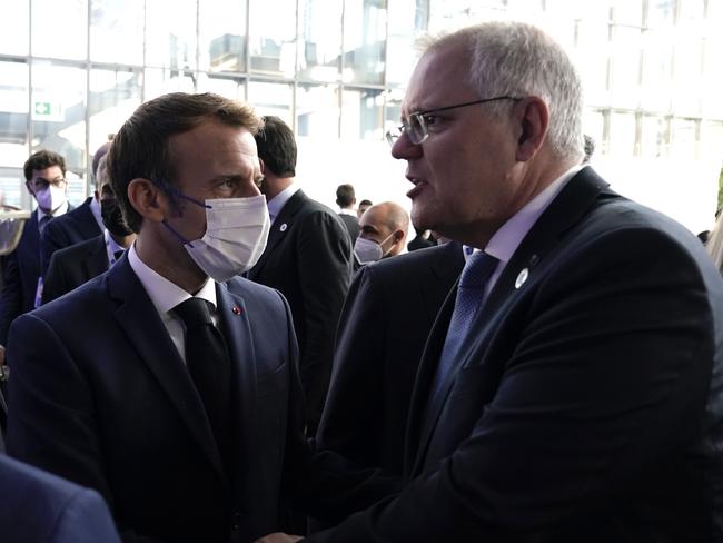 Australian Prime Minister Scott Morrison attends the G20 Official Welcome and Family photo and chats with French President Emmanuel Macron in Rome. Picture: Adam Taylor