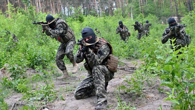 Fighters of Ukraine’s territorial defence unit near the town of Bucha. Picture: AFP