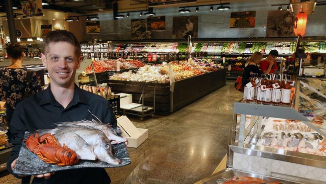 Manager Adam Smith with some fresh seafood. Picture: Stuart Milligan