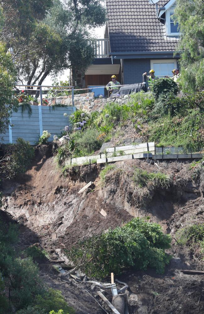 A council worker was forced to ‘leap for his life’ from the property when it went sliding down the hill. Picture: David Crosling