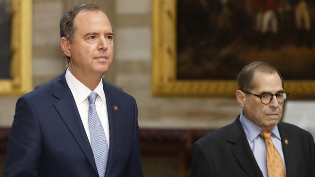 Adam Schiff and Jerrold Nadler walk the impeachment articles to the Senate. Picture: AP