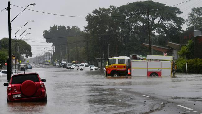 Firefighters outside Ingham Hospital on Monday afternoon during the North Queensland flooding. Photo: Cameron Bates