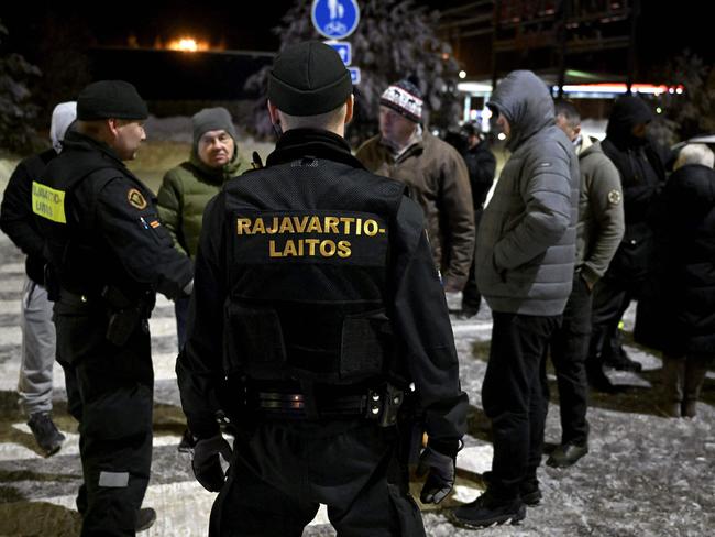 Finnish border guards at the border from Finland to Russia. Finland has accused Russia of trying to “weaponise migration” by sending refugees through the border. Picture: AFP