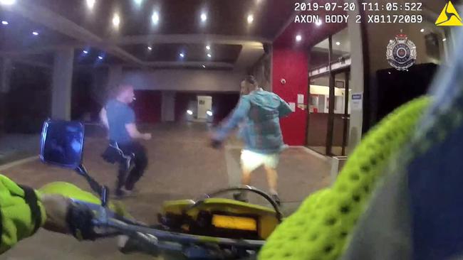 Police bodycam footage shows Mr Russell (left) cornering the man.