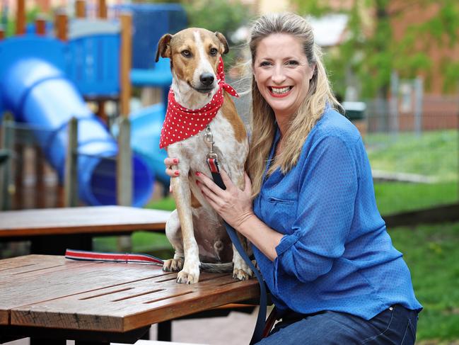 Liza-Jane Snowden with Taxi, a dog she rescued and brought to Tasmania after meeting him while on holiday in Vanuatu. Picture: LUKE BOWDEN