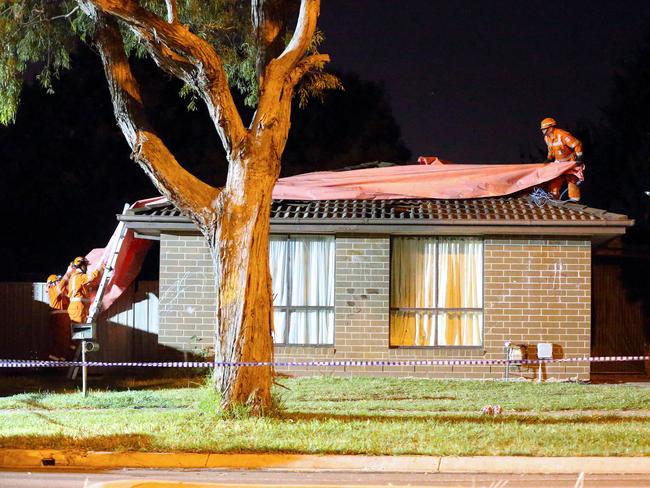 SES crews use a tarp to protect evidence. Photo: Patrick Herve