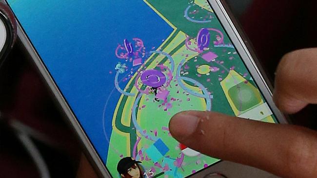 Those flying purple shapes signify a ‘lure model’ in Pokemon Go, which draws users to specific locations to catch Pokemon there.