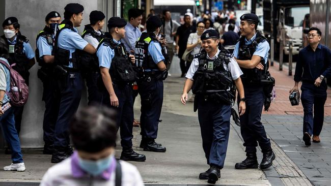 Police keep watch on a street in the Causeway Bay district of Hong Kong on Tuesday. Picture: AFP