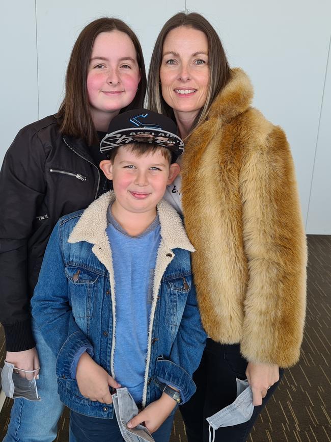 Liz Timson with son Linkin and Denva at Adelaide Airport.