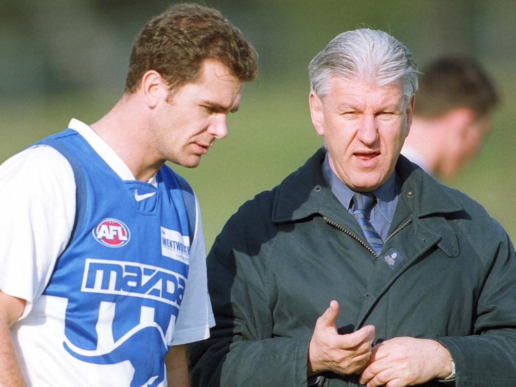 Dr Harry Unglik, pictured with former North Melbourne star Wayne Carey, has spoken out on the AFL’s illicit drugs policy.