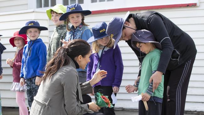 The Duchess of Sussex meets five-year-old Joe Young from Houghton Valley School. Picture: AAP