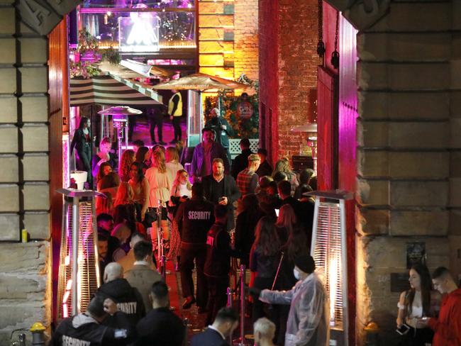 A large crowd of people queue up outside the Argyle in the Rocks, Sydney. 8th August, 2020. Picture by Damian Shaw