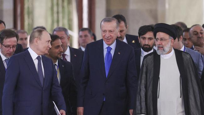 (From left) Russian President Vladimir Putin, Turkish President Recep Tayyip Erdogan and Iranian President Ebrahim Raisi arrive for a joint news conference in Tehran. Picture: AFP