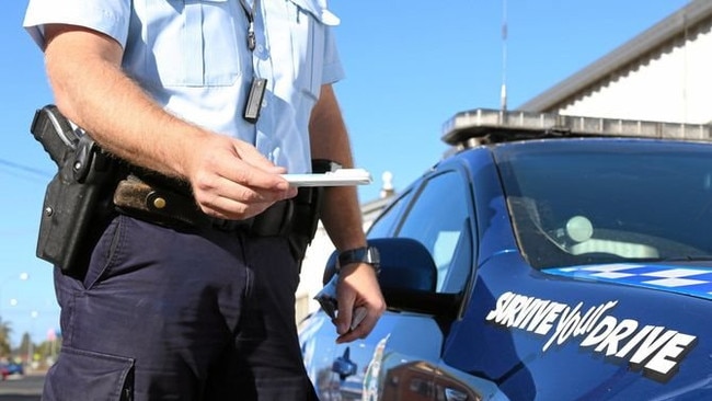 ROADSIDE: Generic drug driving image with police officer.