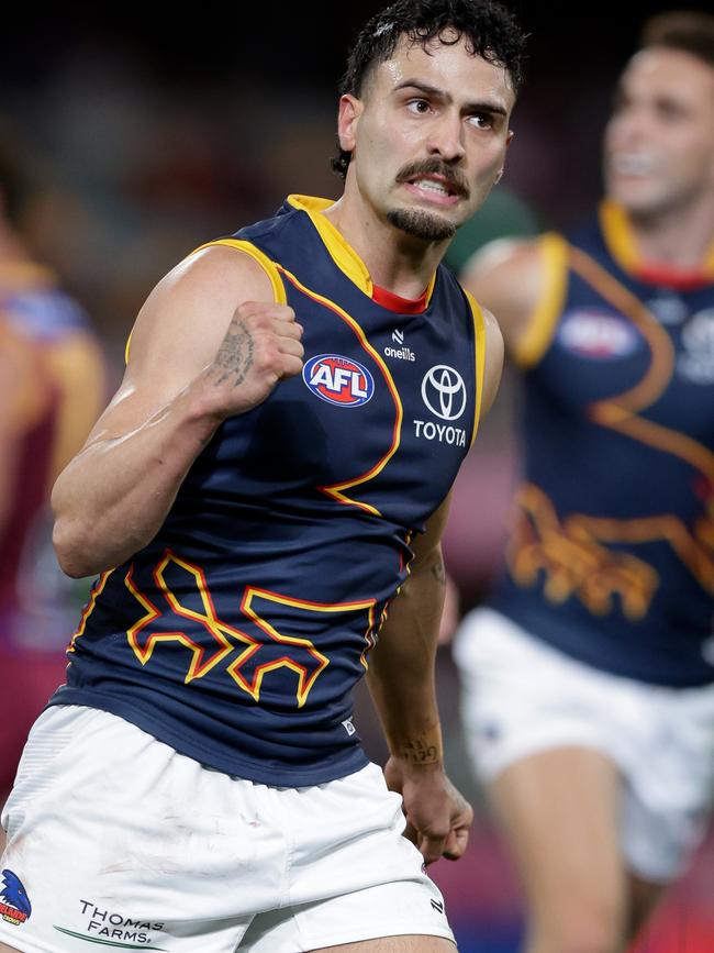 Izak Rankine celebrates kicking one of his two goals for the Crows against the Lions at the Gabba on Sunday. Picture: Russell Freeman/AFL Photos via Getty Images