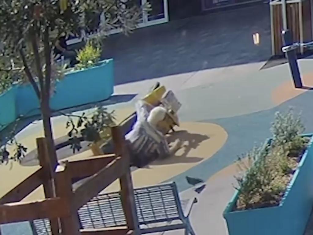 CCTV shows a man on a mobility scooter falling into the in-ground trampoline.