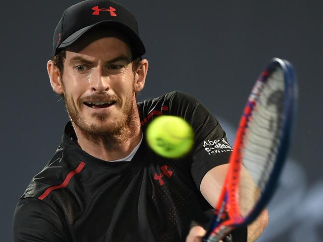 ABU DHABI, UNITED ARAB EMIRATES - DECEMBER 29:  Andy Murray of Great Britain plays a backhand during his exhibition match against Roberto Bautista Agut of Spain on day two of the Mubadala World Tennis Championship at International Tennis Centre Zayed Sports City on December 29, 2017 in Abu Dhabi, United Arab Emirates.  (Photo by Tom Dulat/Getty Images)