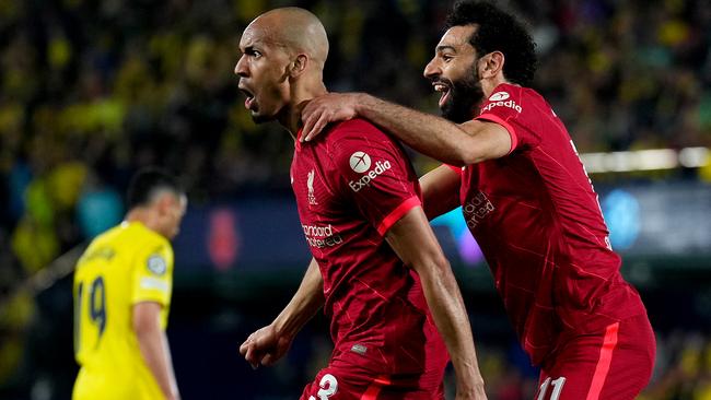 VILLARREAL, SPAIN - MAY 03: Fabinho celebrates with teammate Mohamed Salah of Liverpool after scoring their team's second goal during the UEFA Champions League Semi Final Leg Two match between Villarreal and Liverpool at Estadio de la Ceramica on May 03, 2022 in Villarreal, Spain. (Photo by Aitor Alcalde - UEFA/UEFA via Getty Images)