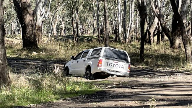 A Toyota HiLux stuck in the mud at the Yarrawonga campsite where two men were left with injuries. Picture: Brayden May