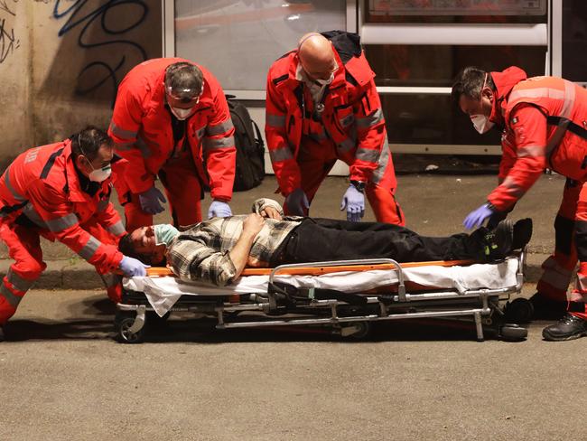 Medical personnel assist the man. Picture: Getty