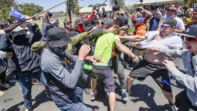 Moments later, violence erupts between him and other protesters. Picture: Jason Edwards