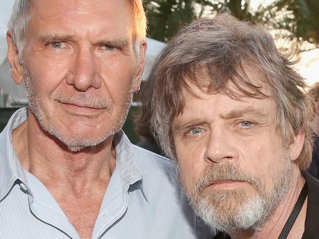 SAN DIEGO, CA - JULY 10: Actors Harrison Ford (L), Mark Hamill and more than 6000 fans enjoyed a surprise "Star Wars" Fan Concert performed by the San Diego Symphony, featuring the classic Â“Star WarsÂ” music of composer John Williams, at the Embarcadero Marina Park South on July 10, 2015 in San Diego, California. (Photo by Jesse Grant/Getty Images for Disney)