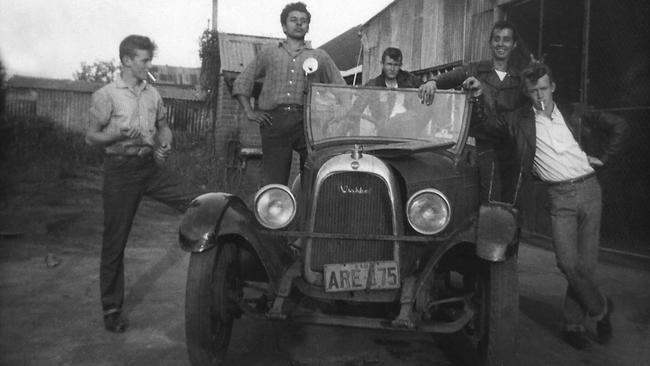 Life was always a bit of a joke ... Paul Hogan (right) and mates with car, circa 1956.