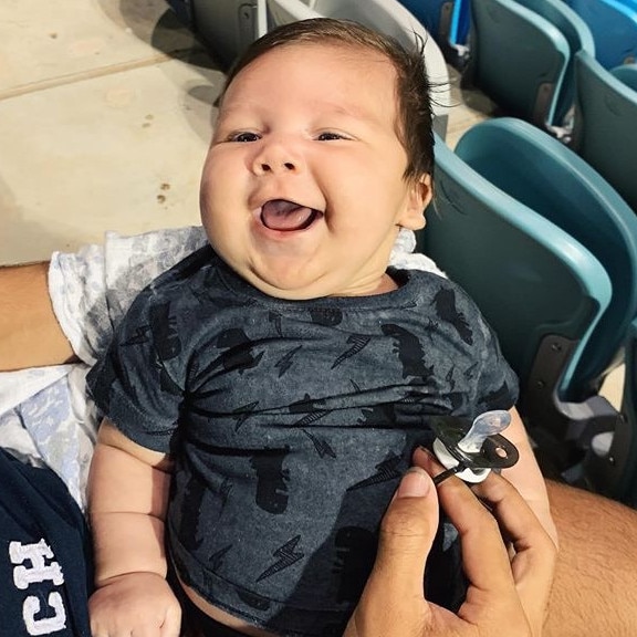 2 month old Lukas Power, happy to see his family at the rugby. Picture: Tash Power