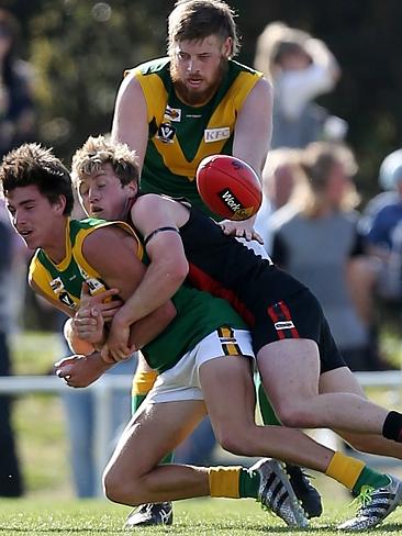 Gippsland Football League Grand Final match between Maffra Eagles and Leongatha Parrots. Maffra became the 2016 premiers, defeating Leongatha 13.10 (88) to 9. 16 (67). Jackson Scott is sandwiched by Leongatha’s Josh Hopkins and Ben Willis. Picture: Yuri Kouzmin