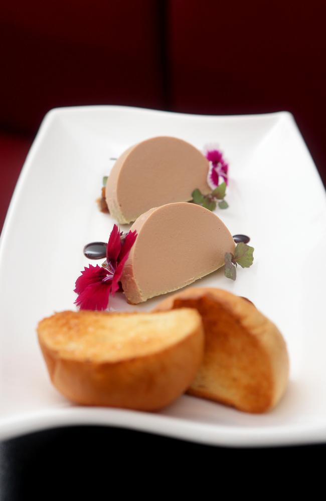 “I opened the batting with the unique taste of a buttery duck liver pâté ($18) decorated with tiny flowers and served with crunchy, toasted brioche.” Picture: AAP/Steve Pohlner