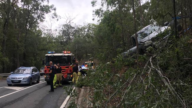 Emergency services crews at the scene of a crash at Tamborine Oxenford Road. Photo: Nicholas McElroy