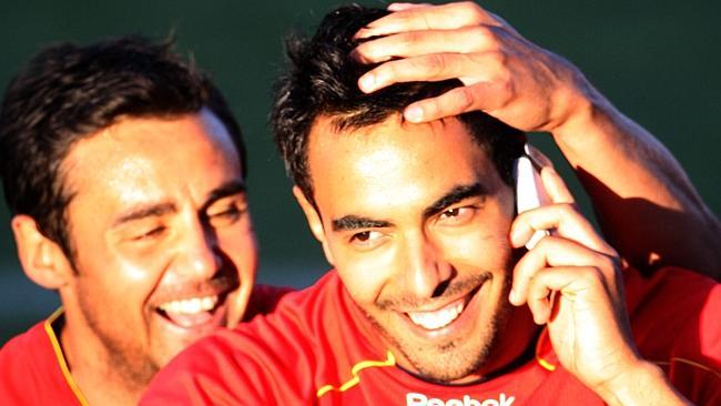  Marco Flores pretends to make a call on his GPS tracker after scoring one of Adelaide United's eight goals. He's being congratulated by Travis Dodd.  