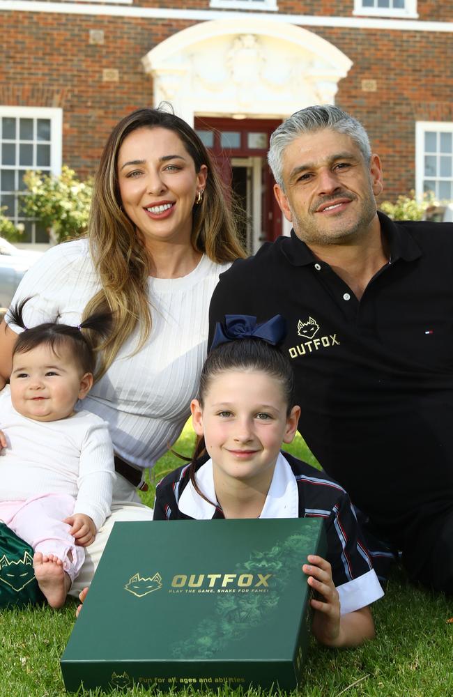 Mia Takos created a board game two years ago, making her the world’s youngest board game inventor. Pictured with her parents, Kristina and Chris, and sister Lexi. Picture: Alison Wynd