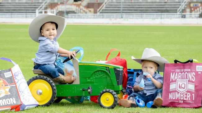 17-month-old Cruz Farrell from Wagga Wagga at RNA Showgrounds with EKKA showbags. Picture: Richard Walker