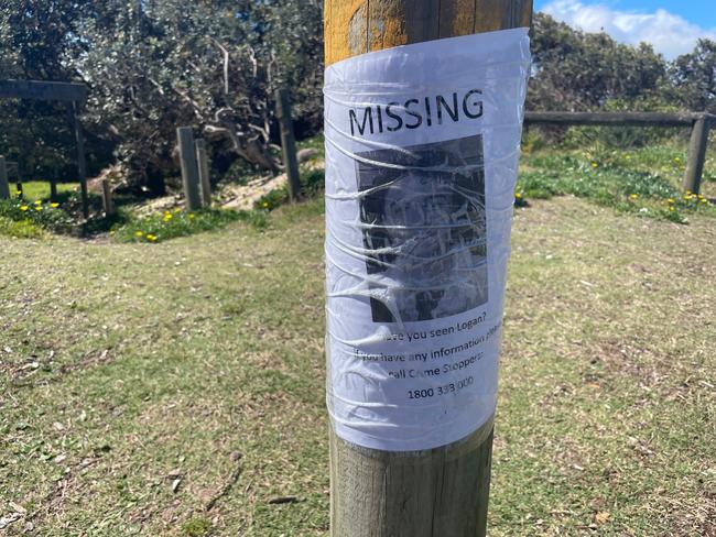 A poster for missing 20-year-old Logan Losurdo on a pole at North Entrance Surf Club.