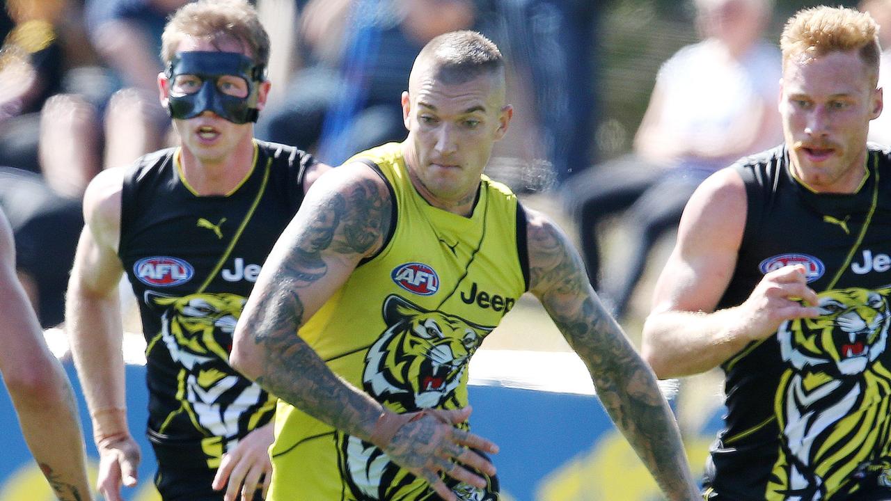 Dustin Martin chases the loose ball ahead of Dylan Grimes and Nick Vlaustin. Pic: Michael Klein