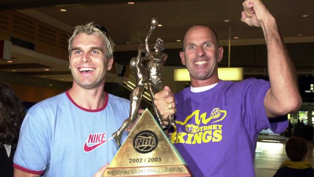 Sydney Kings captain Shane Heal and coach Brian Goorjian show off NBL championship trophy. Picture: Stephen Cooper