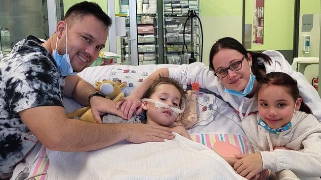 Phil, Tara and Indi Wade, 9, pictured with Mason, 5, at the Queensland Children’s Hospital.