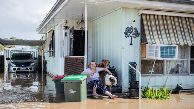 Lisa and her dogs outside their home in Rochester. Picture: Jason Edwards