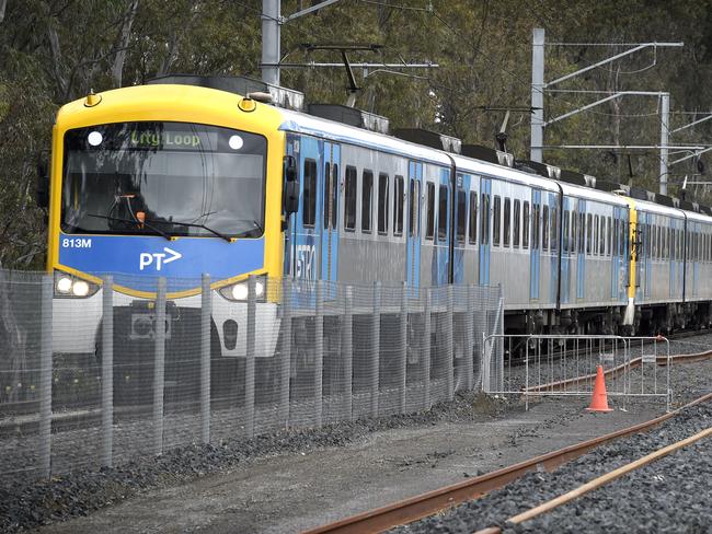 MELBOURNE, AUSTRALIA - NewsWire Photos NOVEMBER 04, 2021: A Metro train runs on the existing track next to the rail duplication project at the Cranbourne rail line in Melbourne's outer south-east. Picture: NCA NewsWire / Andrew Henshaw