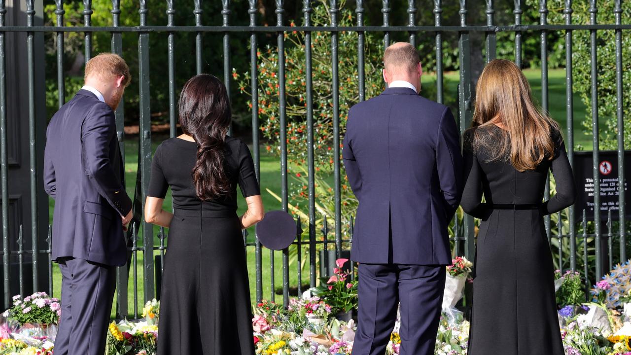 The quartet inspecting the flowers. (Photo by Chris Jackson - WPA Pool/Getty Images)