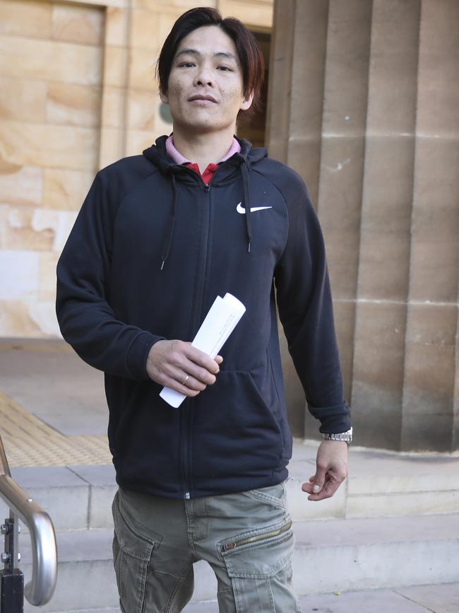 Van Ho Le was arrested at the Adelaide Airport after one of the world’s most expensive aquarium fish was found alive in a bag of water hanging around his neck. Picture: Dean Martin