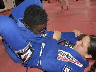 MAT WORK: Keely Geiger works on a triangle choke with Emmanuel Fallah. Geiger will compete at the Australian Brazilian Jiu Jitsu Federation championships in Melbourne on August 11. The Galeb Brothers BJJ athlete earned her spot at the championships after winning gold in the U15 Open Girls Gi division at the Queensland championships. Picture: Jason Gibbs