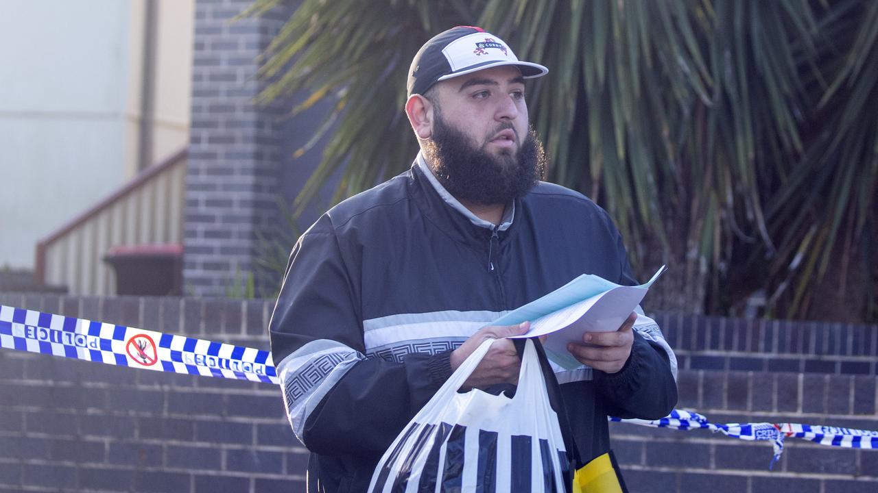 Abraham Derbas, the son of Lametta Fadlallah leaves her home with some bags and paperwork. Picture: Liam Mendes / The Australian.