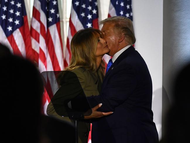 President Donald Trump kisses his wife, Melania Trump, after her speech on day two. Picture: AFP