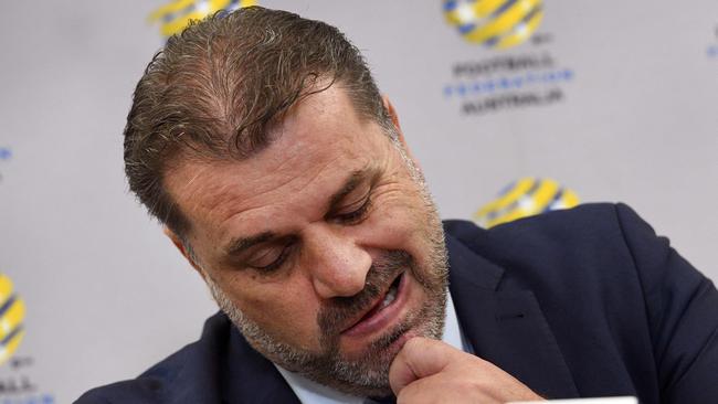 Australia's national football coach Ange Postecoglou reacts during a press conference after announcing his resignation.
